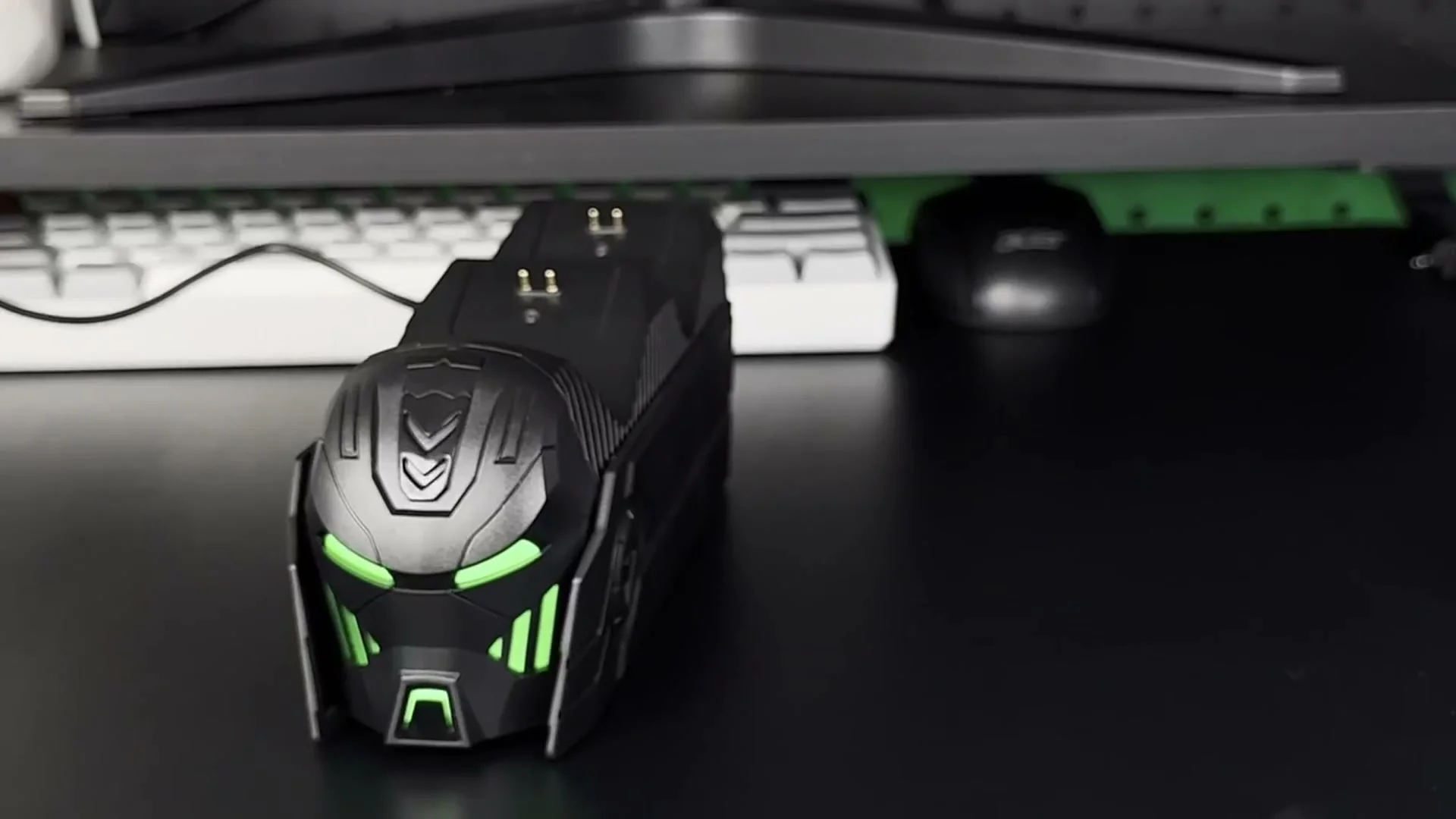 The DINOSTRIKE A100 station under a white controller, its lights green